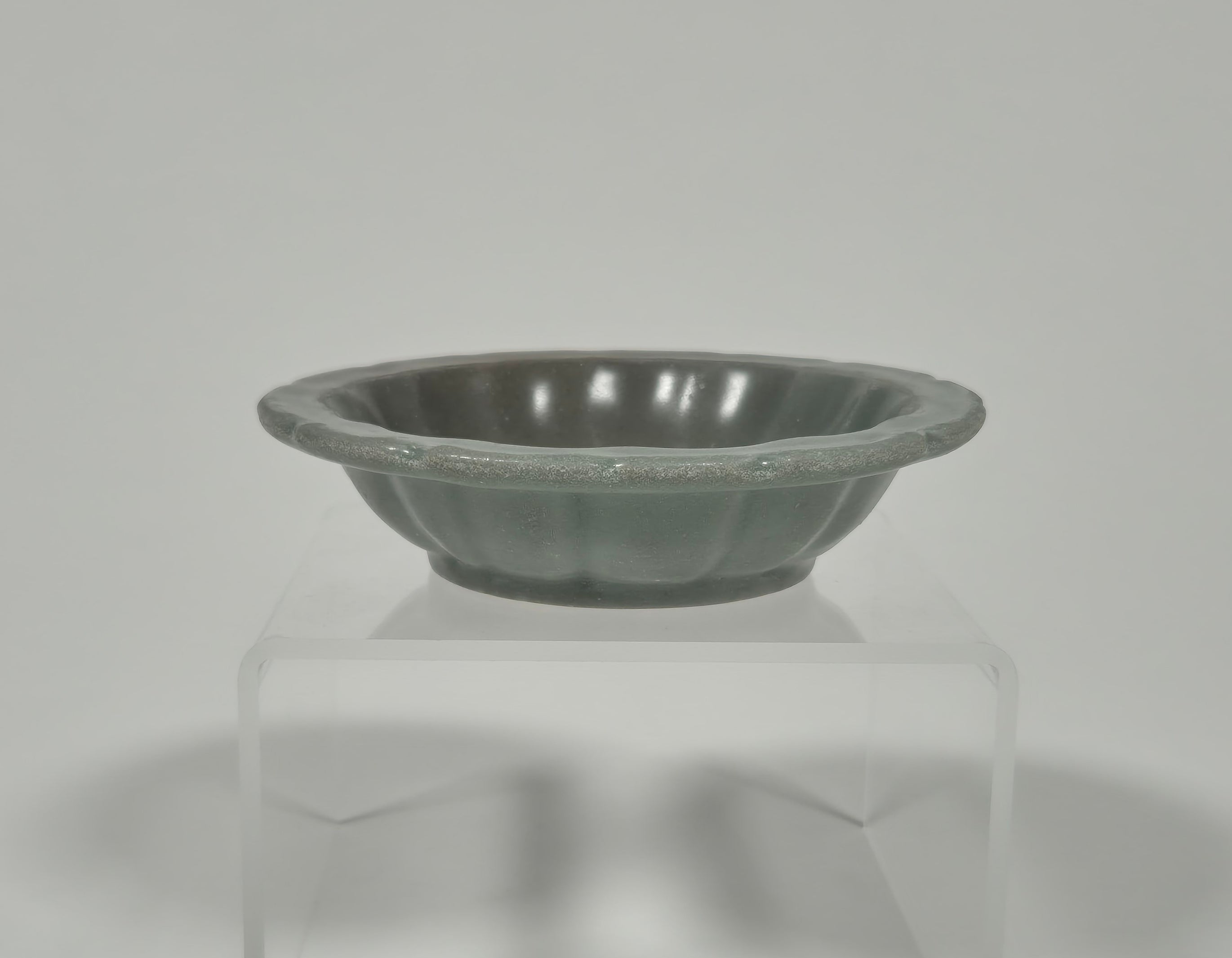A Longquan celadon small chrysanthemum dish – Yuan/Ming